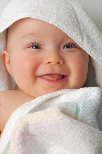 Smiling baby after a bath