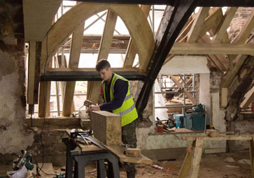 Llwyn Celyn Craftsman working on roof restoration