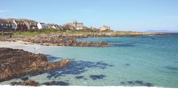 The clear waters of Iona's shoreline