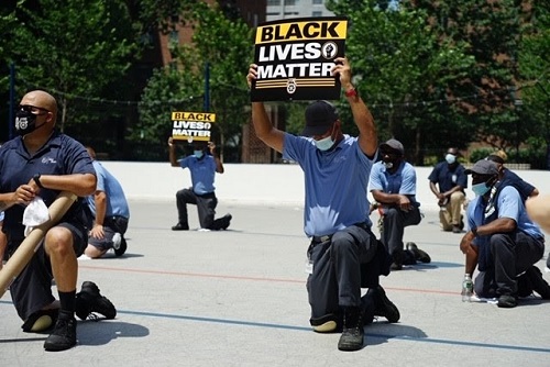 Teamsters kneeling in New York to honor George Floyd.