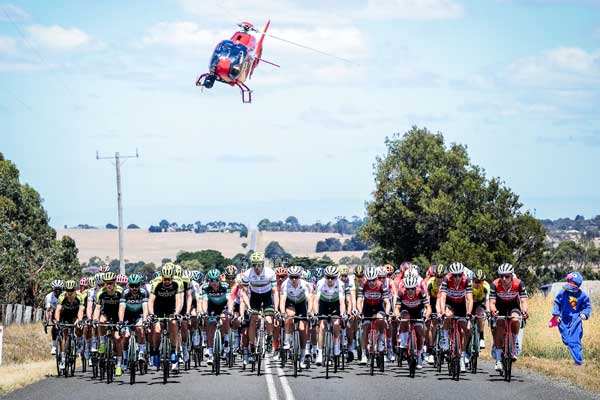 Helicopter hovering over cyclists