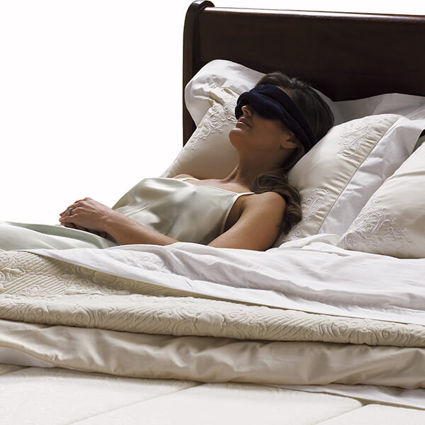 image of woman using sleeping mask