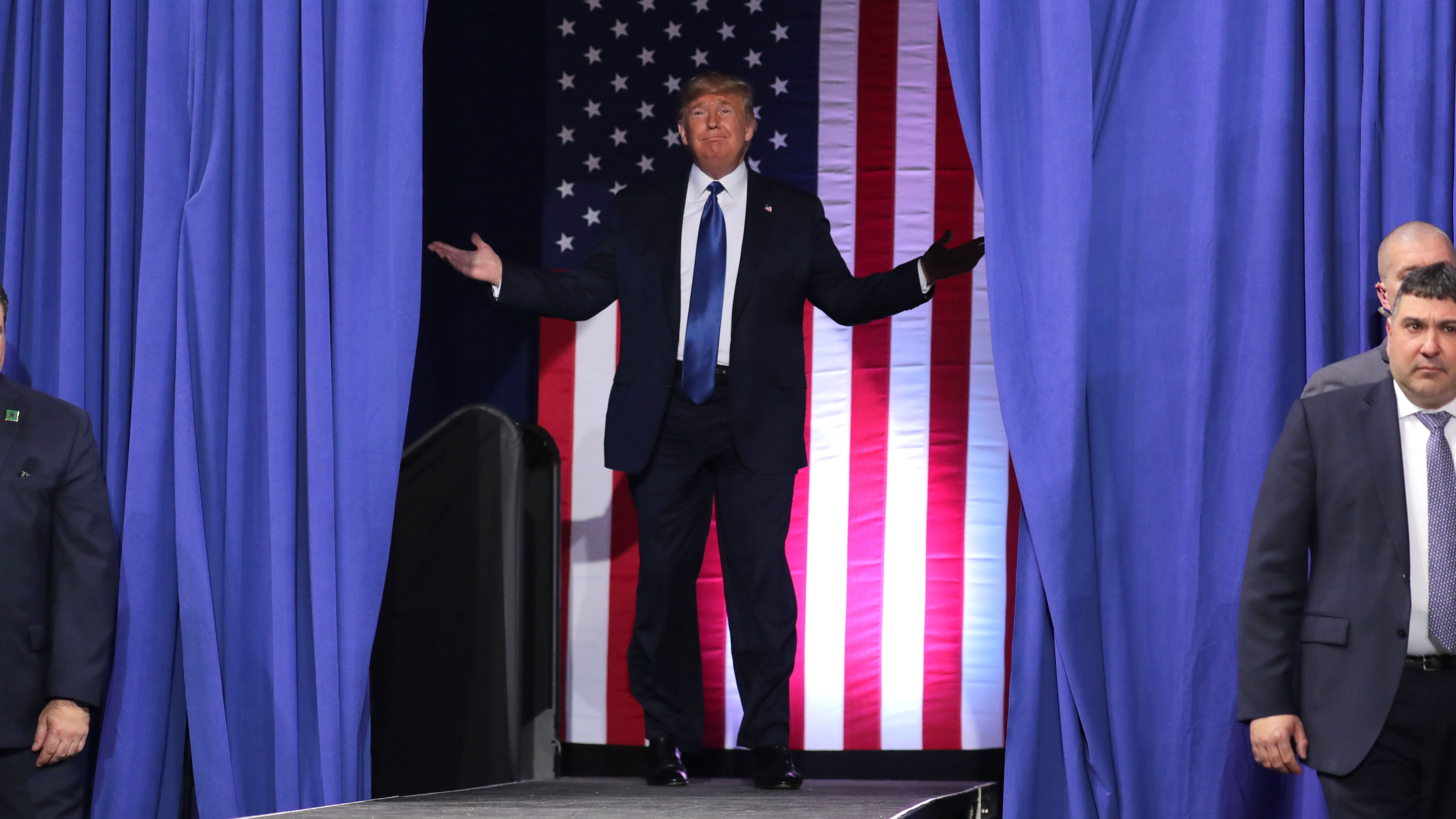 President Donald Trump acknowledges the crowd before he speaks at the UW-Milwaukee Panther Arena on Tuesday.