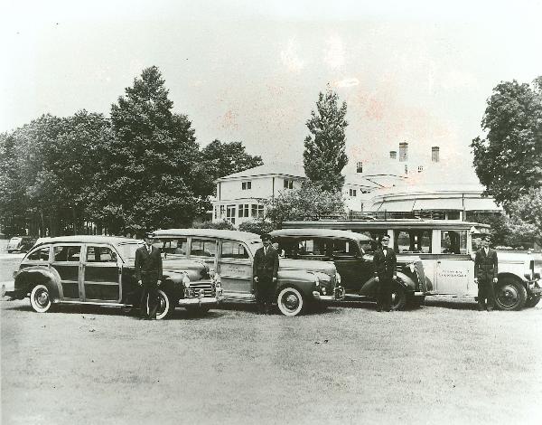 Country club cars and valet outside the building