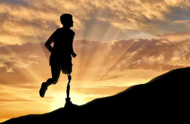 silhoutte of a man running with a prosthetic leg