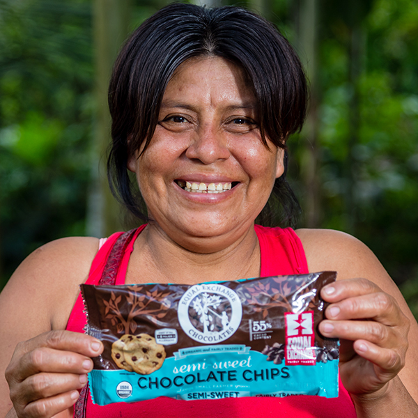 Cacao farmer holding bag of Equal Exchange chocolate chips