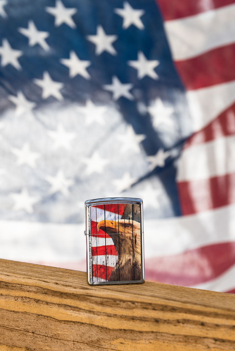 Eagle lighter with flag in background