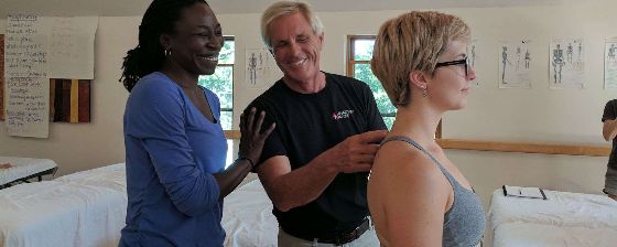 Man teaching two women