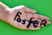 Hands with the word foster written on them 