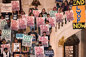 Protesters holding signs, Photo credit: ''Rally in PA Capitol to end death by incarceration'' by joepiette2 is licensed under CC BY-NC-SA 2.0 