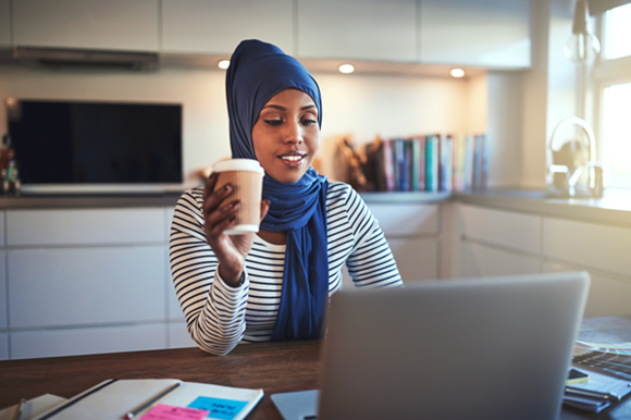 Woman Drinking Coffee & Working